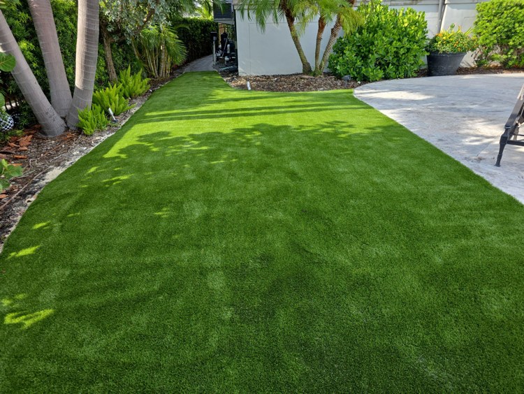 Artificial turf lawn installed on a compacted, free-draining base in Florida